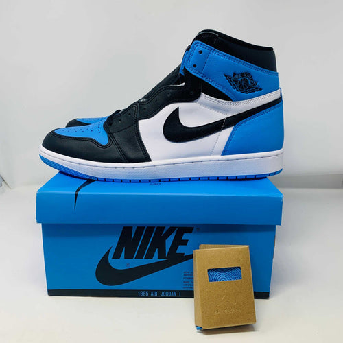 Jordan 1 High UNC Toe sneaker with white and blue colorway on Nike box.