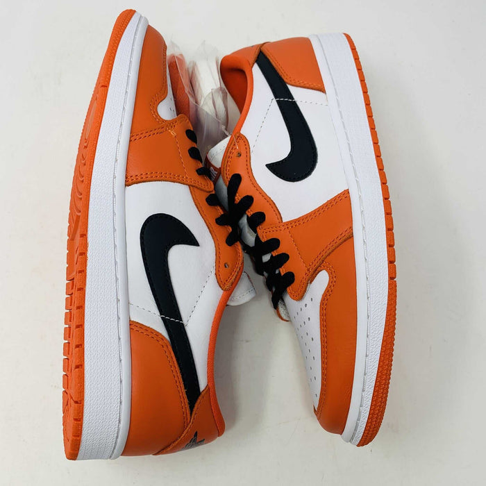 A pair of BRAND NEW Jordan 1 Low Starfish sneakers is displayed, viewed from the front. The orange and white shoes have black laces, a perforated white toe box, and the 100% Authentic Jordan logo is visible on the tongue.