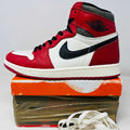 Jordan 1 Retro High OG Chicago Lost and Found sneaker in red, white, and black on box with extra laces and clean uppers