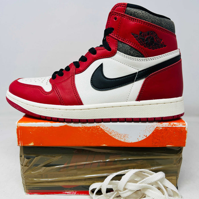 Jordan 1 Retro High OG Chicago Lost and Found sneaker in red, white, and black on box with extra laces and clean uppers