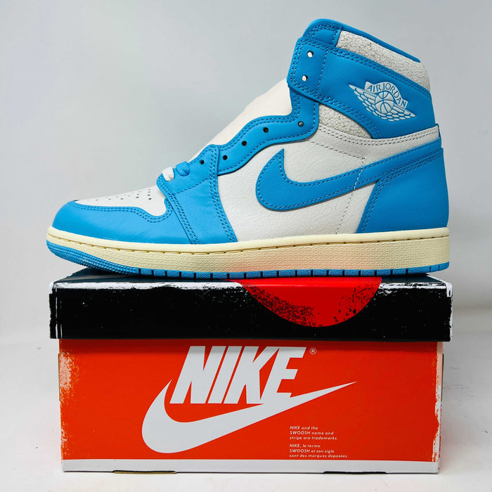 Jordan 1 Retro High OG UNC Reimagined sneaker with blue and white design on Nike box, includes extra laces, 2025 release.