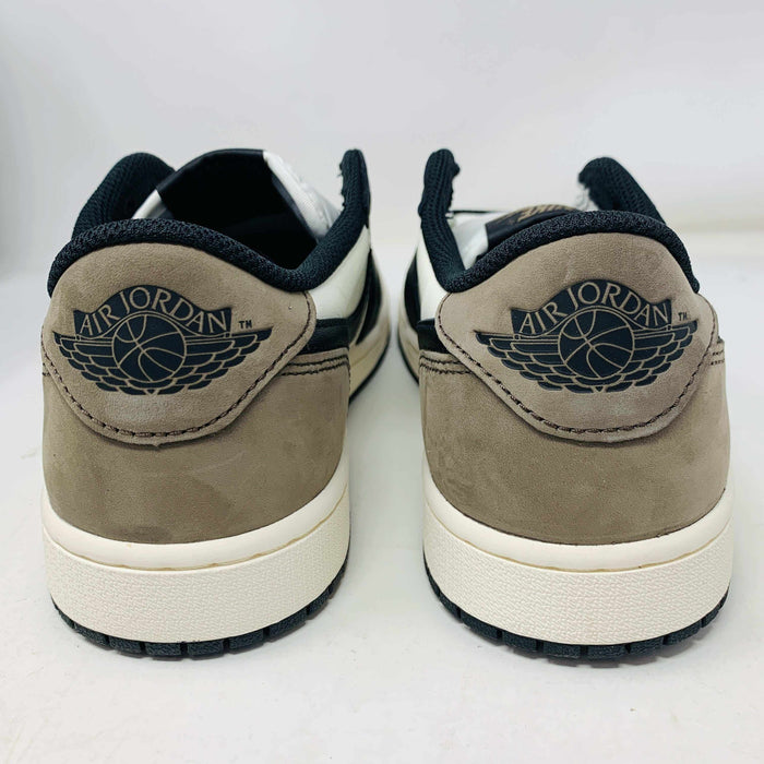 A pair of brand new Jordan 1 Retro Low OG Mocha sneakers has a brown suede heel with the Air Jordan logo in black, crafted in 2024. They feature white midsoles, black outsoles, and a stylish black and white interior. The box condition is good for quality delivery.