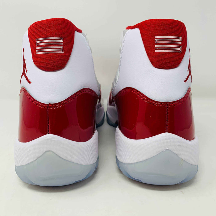 Jordan 11 Retro Cherry 2022 white and red sneakers featuring premium leather and mesh.