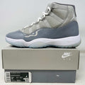 Jordan 11 Retro Cool Grey 2021 sneaker on Nike Air box with clean uppers and grey patent leather detailing