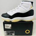 2023 Jordan 11 Retro DMP white black gold sneaker with yellowing soles on box