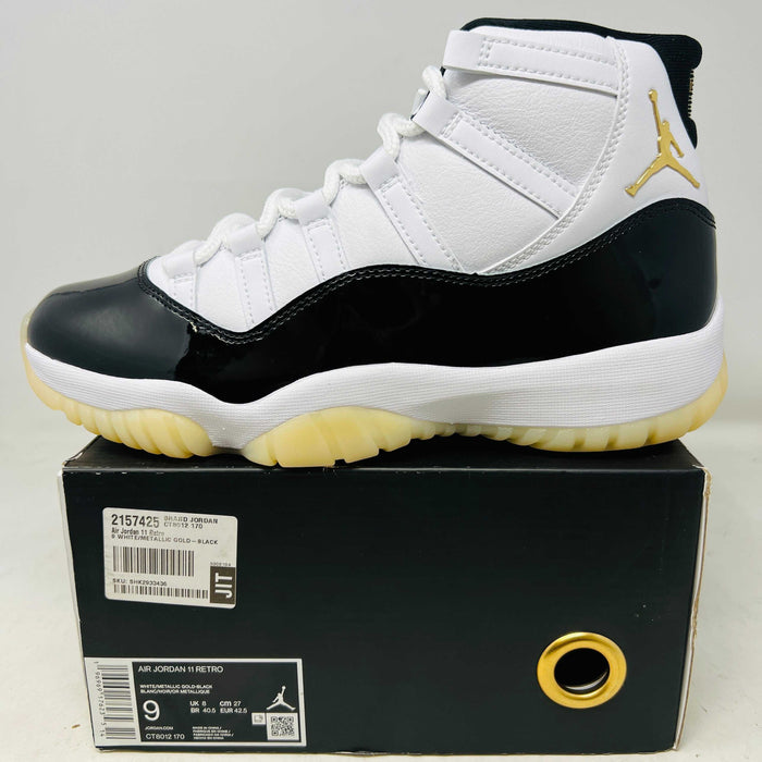 2023 Jordan 11 Retro DMP white black gold sneaker with yellowing soles on box