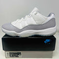 Jordan 11 Retro Low Cement Grey sneaker in white and grey on Nike Air box, size 12, 2023 model