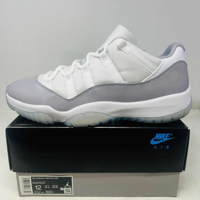 Jordan 11 Retro Low Cement Grey sneaker in white and grey on Nike Air box, size 12, 2023 model