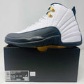 Jordan 12 Retro Taxi 2025 sneaker in white and black on box size 10