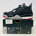Jordan 4 Retro Bred 2019 sneakers in good condition with slight heel drag and clean uppers