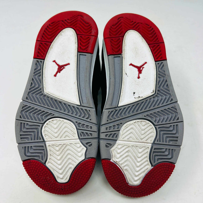 The Jordan 4 Retro Bred (2019) (PS) in black and red, featuring clean uppers with a white midsole and gray accents, sits on its original black shoebox. The box displays size, product details, and the iconic Jumpman logo, underscoring these authentic shoes from Jordans 2019 collection.