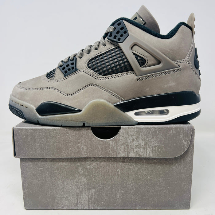 Jordan 4 Retro Cave Stone sneaker in light gray with black accents on box, 2025 model
