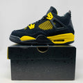 Jordan 4 Retro Thunder 2023 GS sneakers, black and yellow, brand new condition.