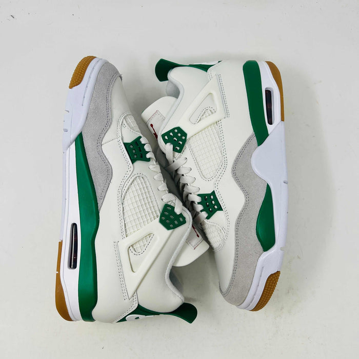 The Jordan 4 SB Pine Green features white and green sneakers with gum soles, mesh panels, and green accents on the lace tabs and soles, set against a plain white background.
