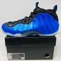 Nike Air Foamposite One International Blue sneaker with clean uppers and light wear on black shoe box