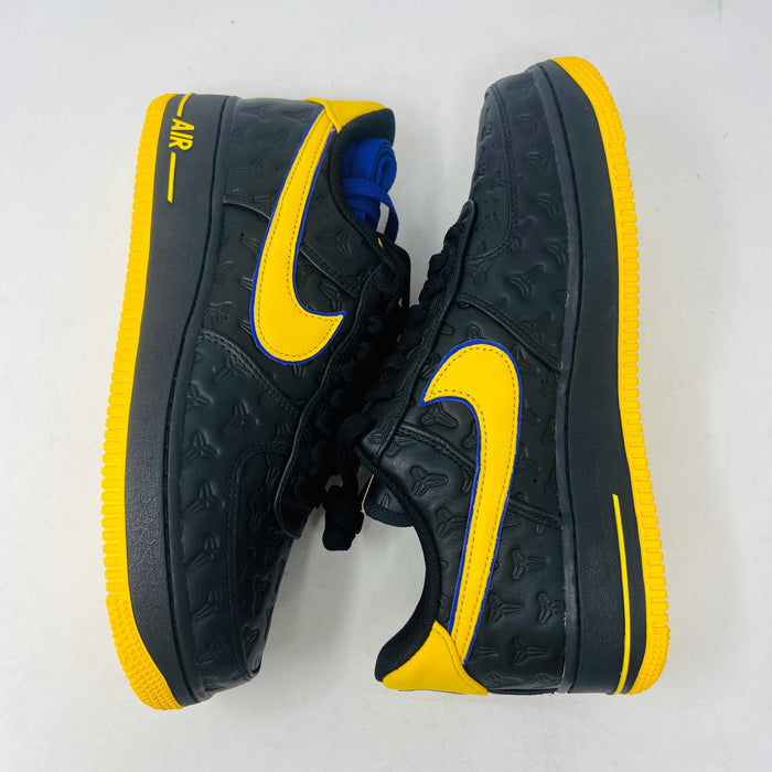 Brand new Nike Air Force 1 Low Kobe Bryant Lakers Away sneaker in black with yellow and blue accents, featuring embossed details. Displayed on a white box with a yellow Nike logo and Kobe Bryant symbol. Limited edition of 8000, ideal for those seeking standout accessories.