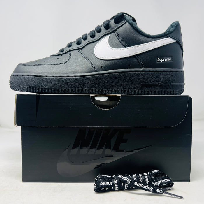 Nike Air Force 1 Low Supreme Black White sneaker on box with extra Supreme laces