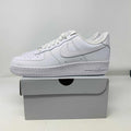 Nike Air Force 1 Low Triple White sneakers, brand new condition, on a shoe box.