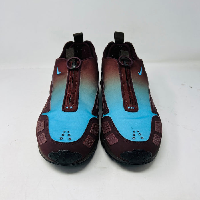 The Nike Air Max Sunder Burgundy Crush Baltic Blue (W) sneakers, released in 2024, feature a gradient design from blue to burgundy with a geometric side pattern and small blue swoosh, displayed against a white background with light wear.