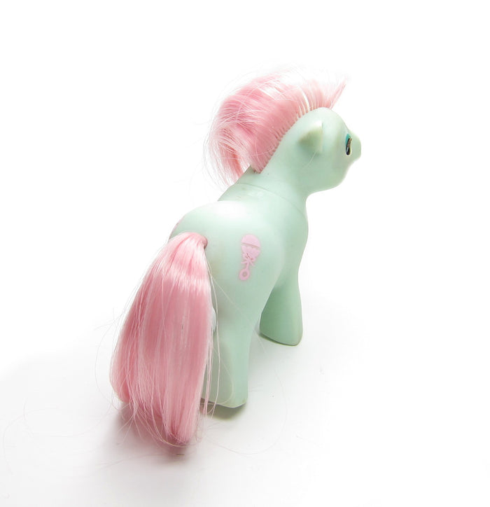 Baby Cuddles pony with pink rattle symbol