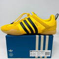 adidas Ballerina Bad Bunny Bold Gold yellow sneaker with black stripes on blue shoe box