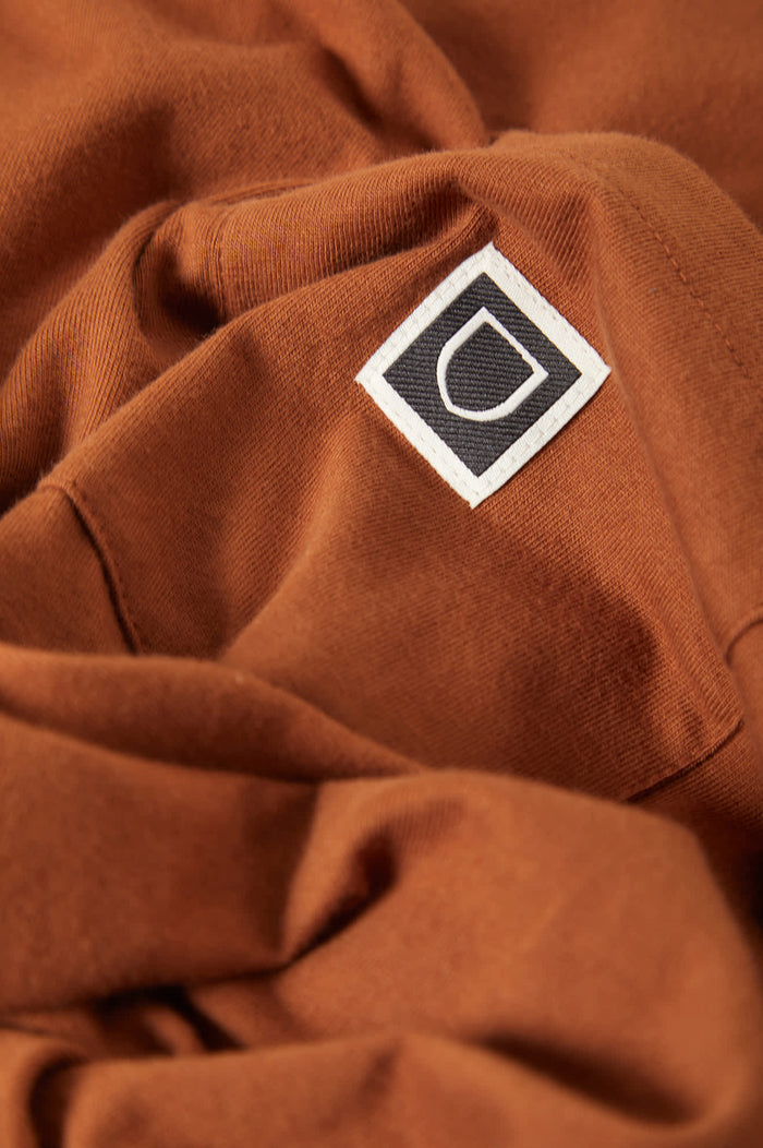 Men's Beta Sheild Short Sleeve Pocket T-Shirt in the color Brown Sugar - Additional Laydown image