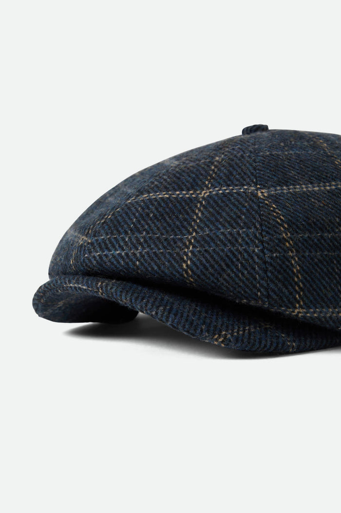 Unisex Brood Newsboy Cap in the color Mood Indigo/Tan - Additional Laydown image