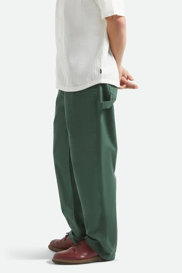 Men's Builders Carpenter Stretch Pant in the color Primary Green - Men's Side View