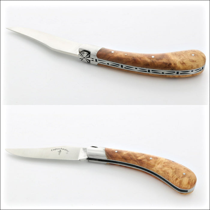 Capuchadou 12 cm Classic Folding Knife - Maple Burl. Top-down view of the open knife, showing the light brown maple burl handle and polished blade. Handcrafted details, 100% Made in France.