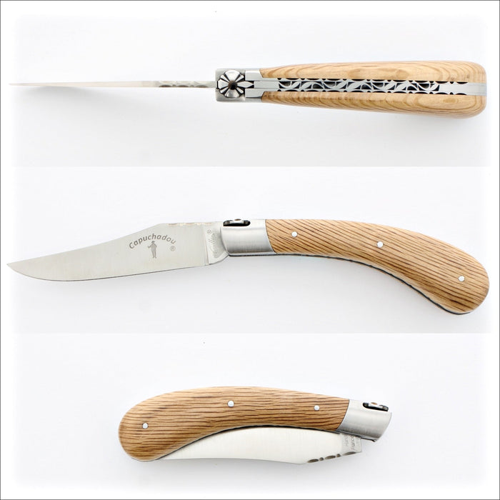 Capuchadou 12 cm Guilloche Oak Barrel Wood, side view of open knife with engraved blade and handle. Handcrafted details, 100% Made in France.