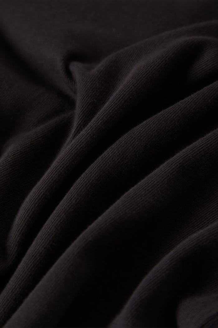 Women's Carefree Organic Garment Dye Slim L/S T-Shirt in the color Black - Additional Laydown image