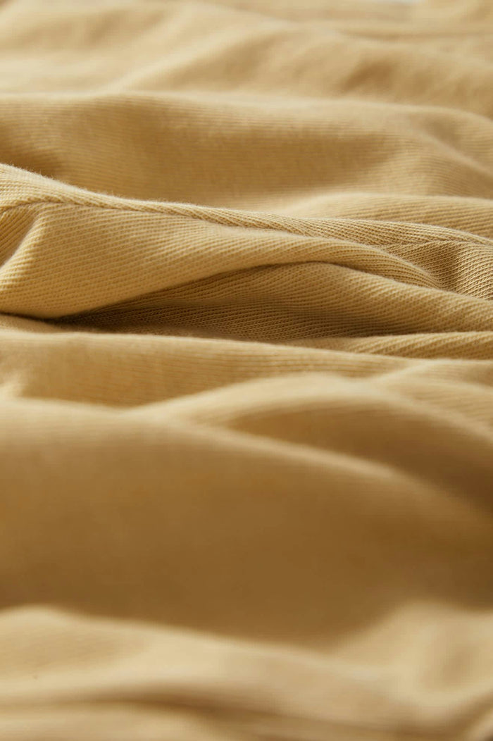 Women's Carefree Organic Garment Dyed Lounge Short in the color Pale Khaki - Additional Laydown image