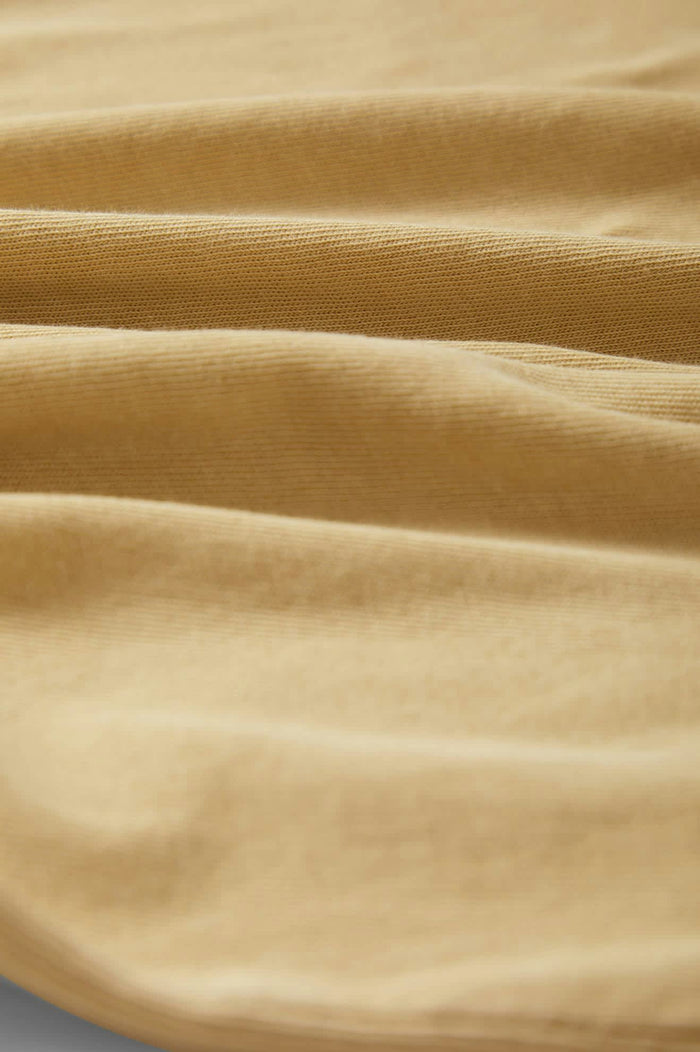 Women's Carefree Organic Garment Dyed Muscle Tank in the color Pale Khaki - Additional Laydown image