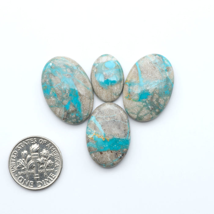 Carico Lake Turquoise cabochons with vibrant aqua-blue to turquoise tones and natural matrix, ideal for rings, pendants, and artisan jewelry.