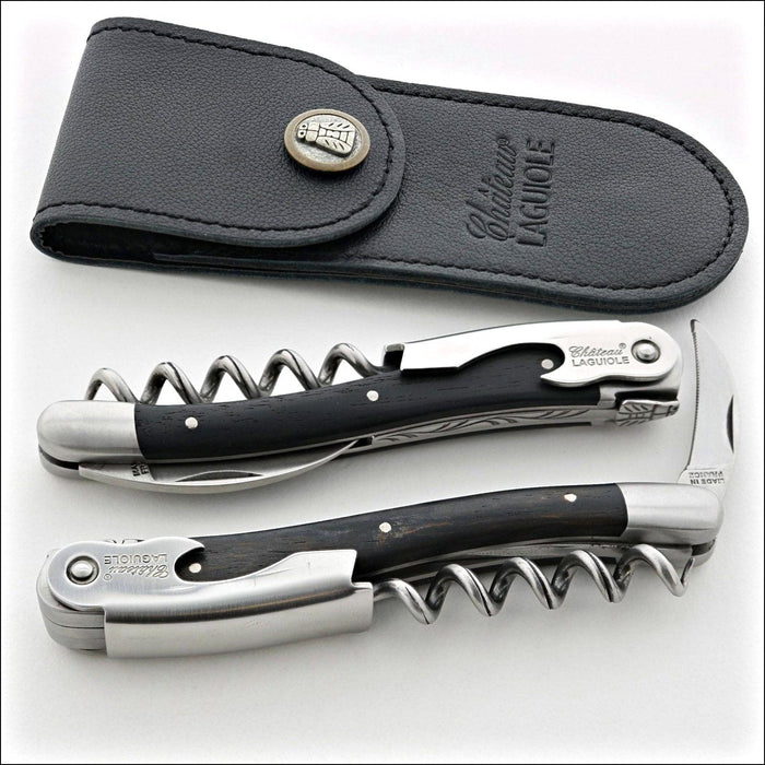 Chateau Laguiole Classic Ebony Corkscrew, top-down view of two corkscrews and a black leather case. Handcrafted details, 100% Made in France.