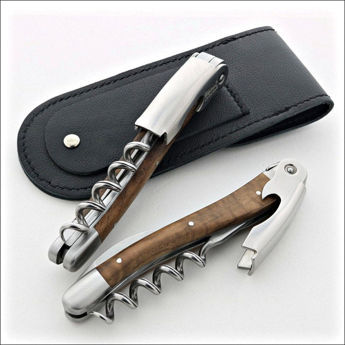 Chateau Laguiole Classic Walnut Corkscrew, top-down view of two corkscrews with a black leather case. Handcrafted details, 100% Made in France.
