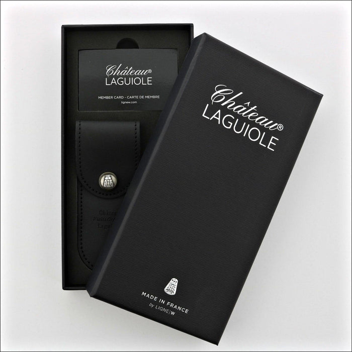 Chateau Laguiole Classic Walnut Corkscrew, close-up of the black gift box with logo and member card. Handcrafted details, 100% Made in France.