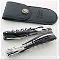 Chateau Laguiole Melchior Dark Horn Tip Handle, close-up of two corkscrews with black leather sheath. Handcrafted details, 100% Made in France.