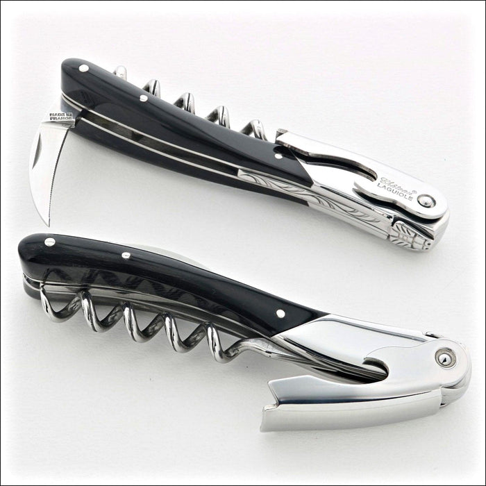 Chateau Laguiole Melchior Dark Horn Tip Handle, top-down view of two corkscrews. Handcrafted details, 100% Made in France.