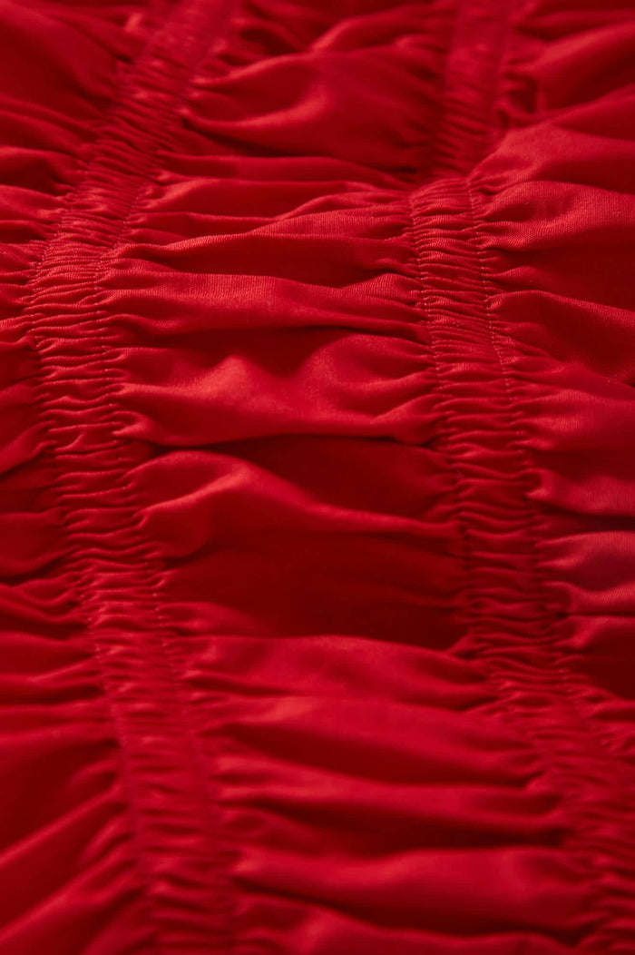 Women's Eden Smocked Top in the color Crimson - Additional Laydown image