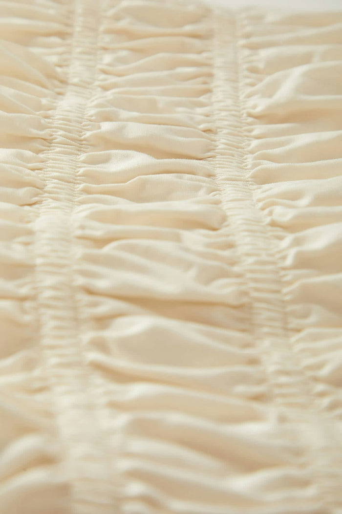 Women's Eden Smocked Top in the color Off White - Additional Laydown image