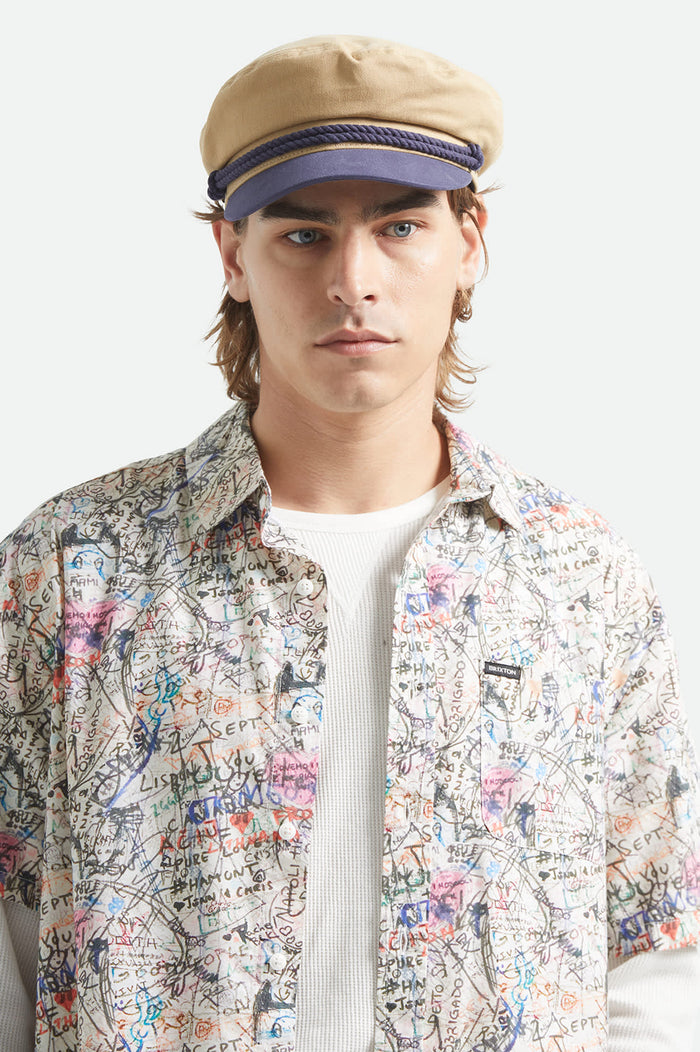 Unisex Fiddler Fisherman Cap in the color Sand/Washed Navy - Men's Front View
