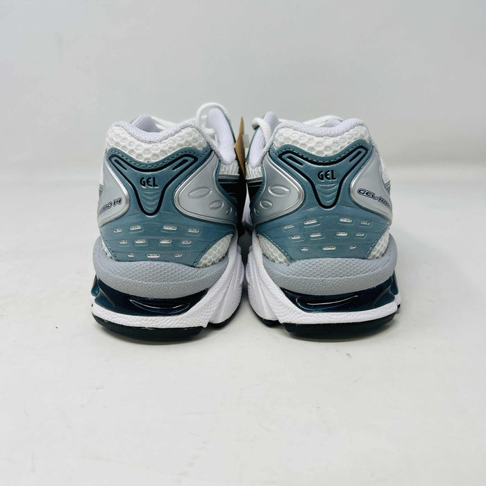 The ASICS Gel-Kayano 14 White Fjord Grey running shoe stands on a brown ASICS box, featuring intricate designs, a breathable mesh upper, and a cushioned thick sole for support. Its 100% authentic.
