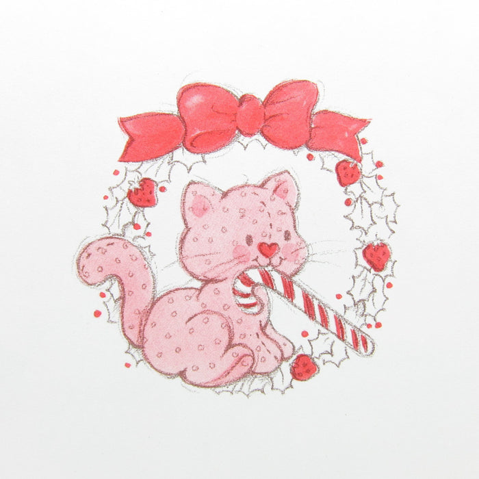 Custard the cat with a candy cane in a wreath