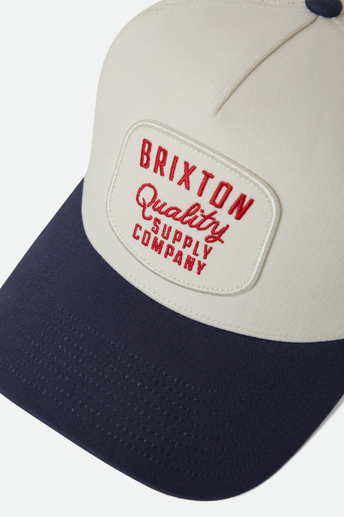 Unisex Hubal NetPlus Trucker Hat in the color Off White/Midnight Blue - Additional Laydown image