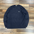 Preowned Kith LAX long sleeve tee in asteroid color laid flat on wooden floor