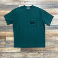 Preowned Kith Quinn Tee Rhythm green T-shirt with pocket logo on wooden background