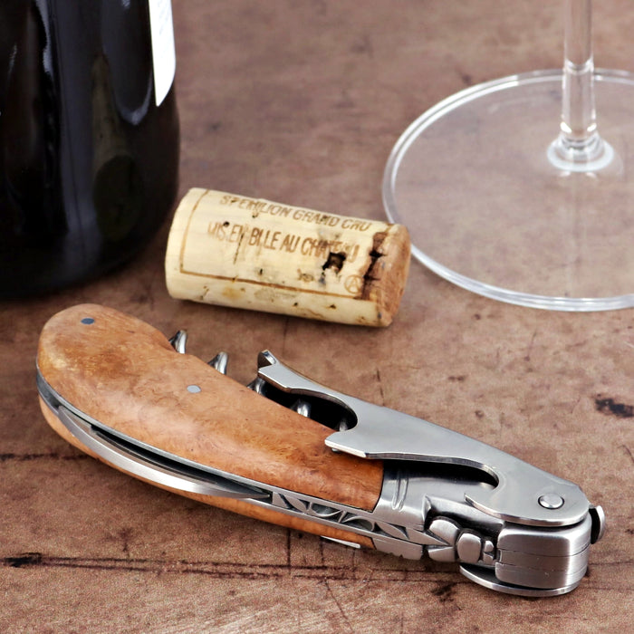 Laguiole Magnum Briarwood Corkscrew, close-up of the light brown wood handle and silver metal tools.