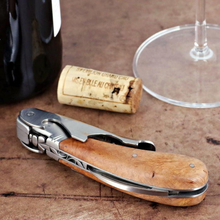 Laguiole Magnum Briarwood Corkscrew, close-up of the light brown wood handle and silver metal.
