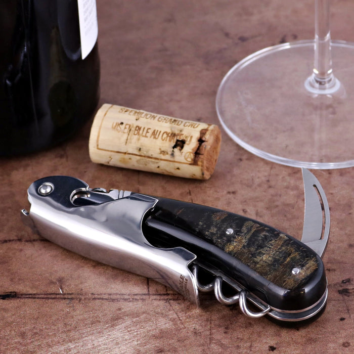 Laguiole Magnum Buffalo Bark Corkscrew, close-up of its dark, patterned handle and polished metal body.